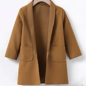 Toddler boy open overcoat